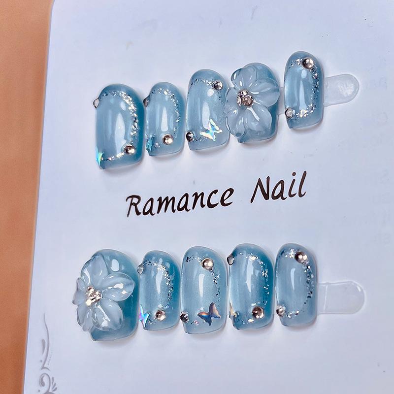 

Spring/Summer Blue Ice Translucent Hand-Painted Cat Eye Nail Tips with Carved Flowers Large L