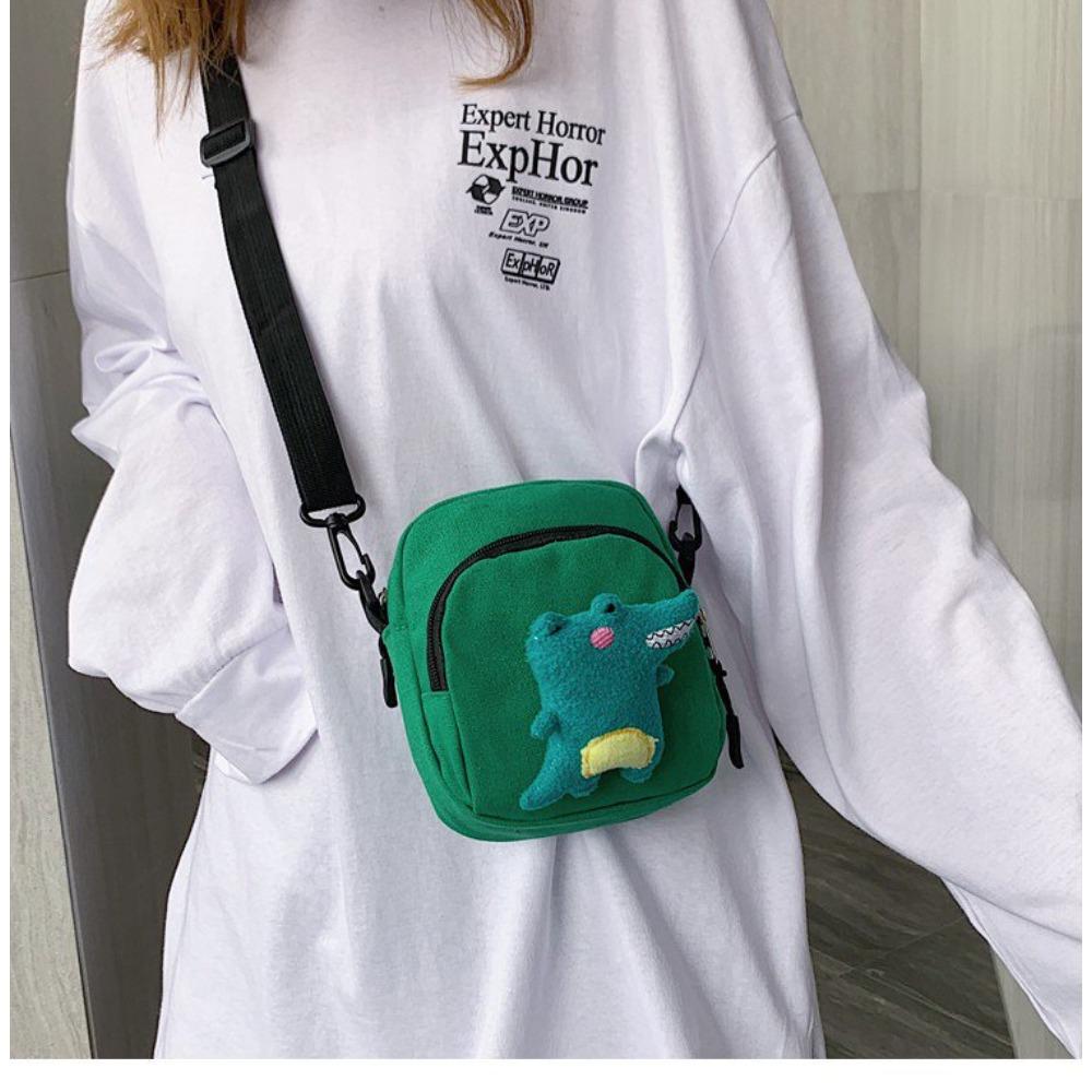 

Bag female cartoon cute little dinosaur canvas bag contrasting color student bag personalized shoulder oblique span bag зелений