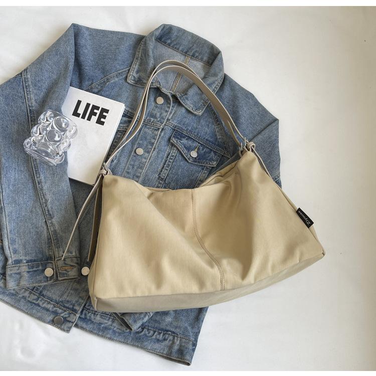 

Casual canvas tote bag women s 2025 new large-capacity commuter bag versatile shoulder bag college student class bag хаки