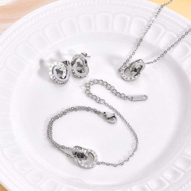 

Комплект украшений с двойным кольцом с римскими цифрами: Ожерелье, браслет и серьги, инкрустированные бриллиантами - Легкая роскошь, Неподвластное времени сияние серебряный