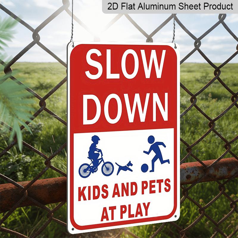 2D Flat Slow Down At Play Metal Sign - Durable Metal Safety Signage, 12*8 Inches, Easy To Install, Red and White with Blue Graphics, Perfect for