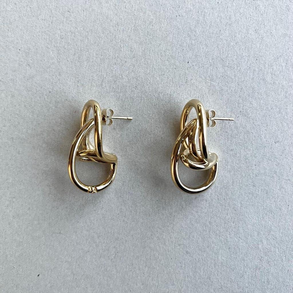 Used PHILIPPE AUDIBERT/gold twist loop earrings
