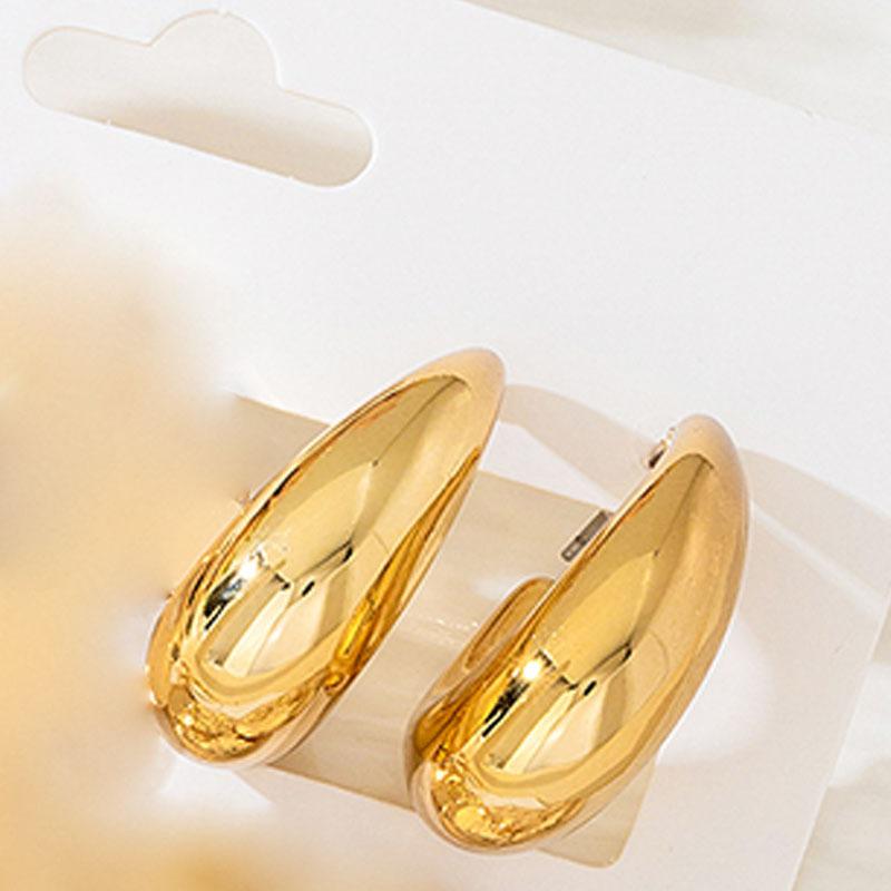 A set of four pairs of golden yellow glossy earrings, flower love, geometric style, simple, elegant and fashionable