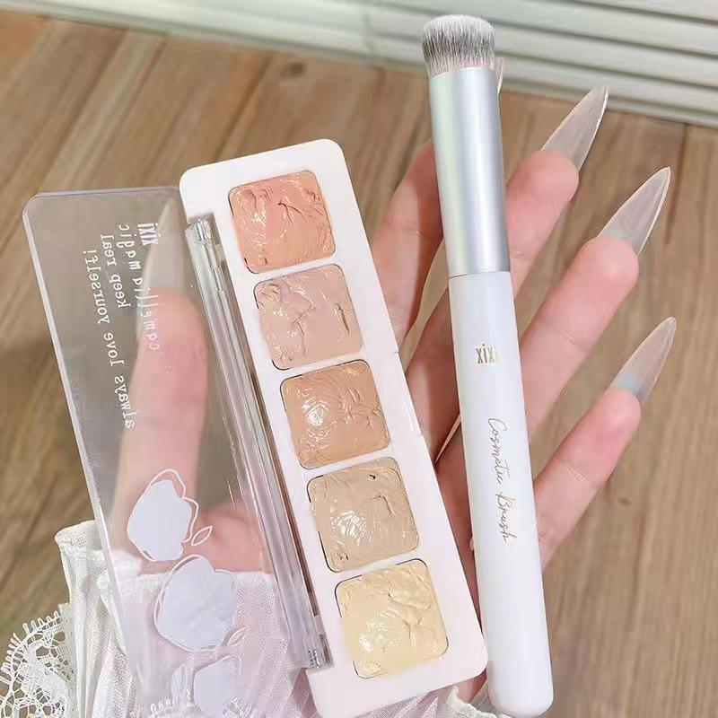 Xixi Concealer Cream: Perfect for acne scars, dark circles, and tear troughs. Moisturizing, natural, and available in five shades for beginners.