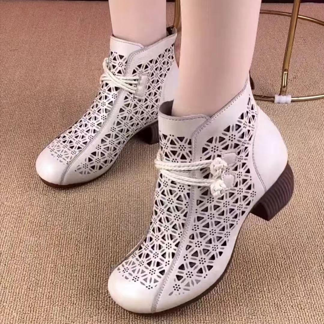 

Summer soft leather hollow short boots ethnic wind hole soft-soled cool boots medium heel thick heel retro mother comfortable sandals 41 білий