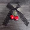 Cherry Pendant Keychain With Bowknot Fashionable Cherry Keychain with Pearlescent Bowknot Accents for Trendsetters