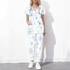 Women Plus Size White Floral Printed Scrub Set Cutout Neck Short Sleeve Pocket Top Long Pants