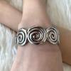 Elegant Metal Textured Spiral Bangle: Luxurious European-American Style Bracelet for Women