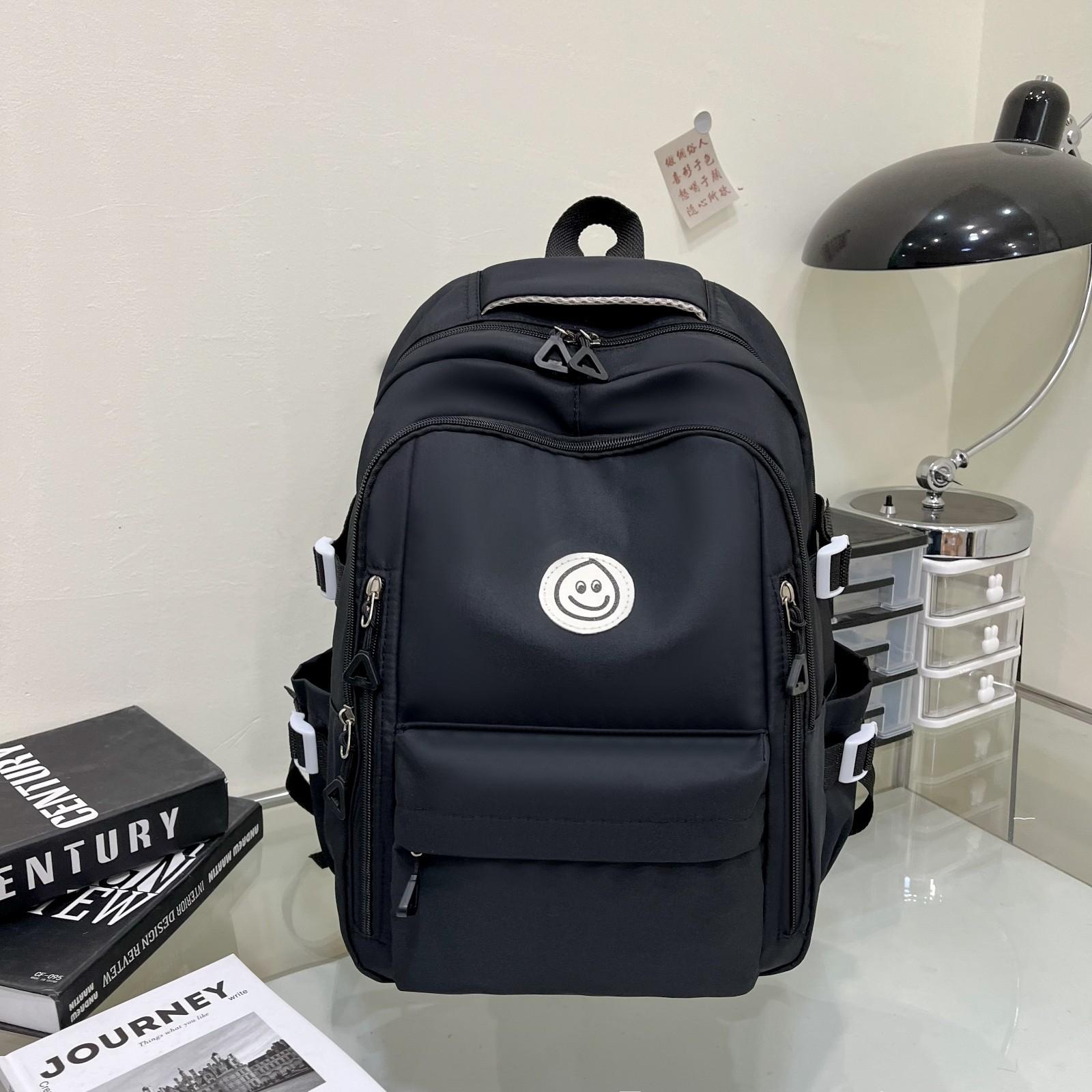 

2024 весна и лето новый студенческий рюкзак сумка, модная сумка для отдыха и путешествий рюкзак с изображением смайлика чёрный