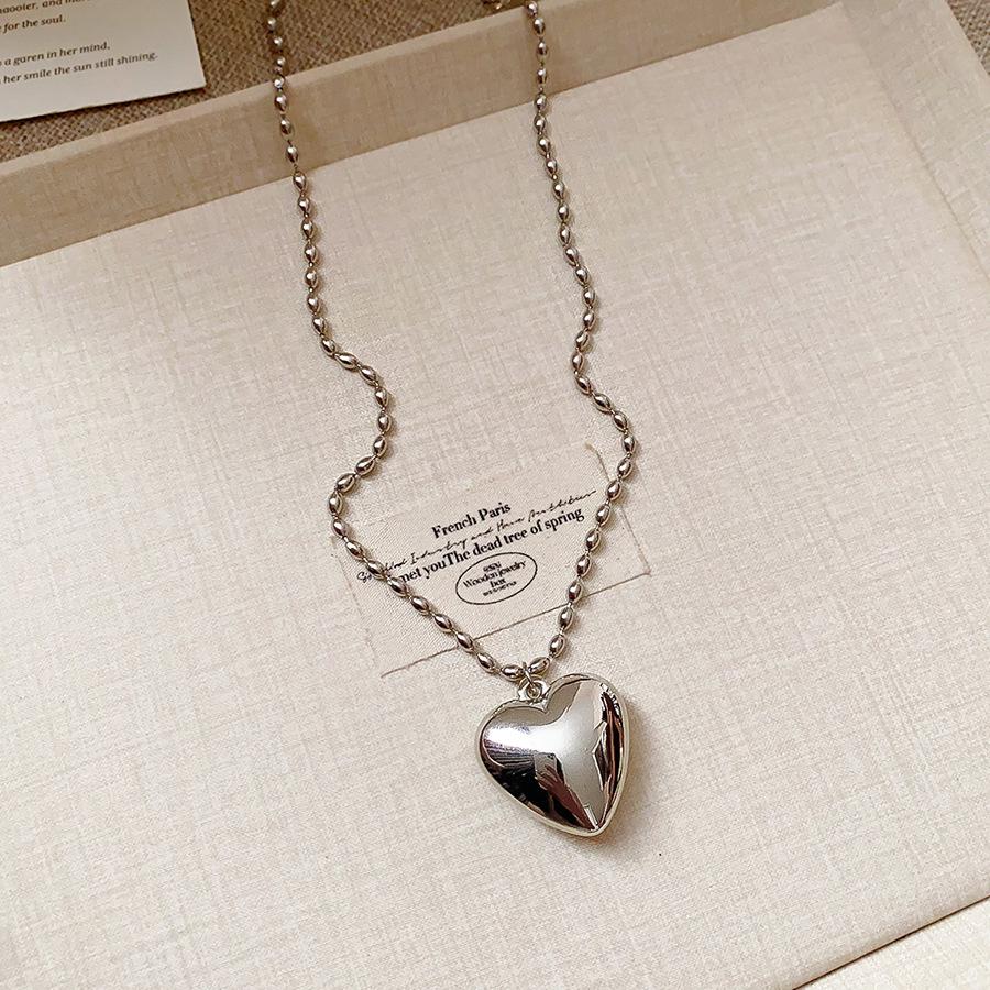 Retro Ethnic Heart Necklace: Wooden Flower Pendant Sweater Chain for Women