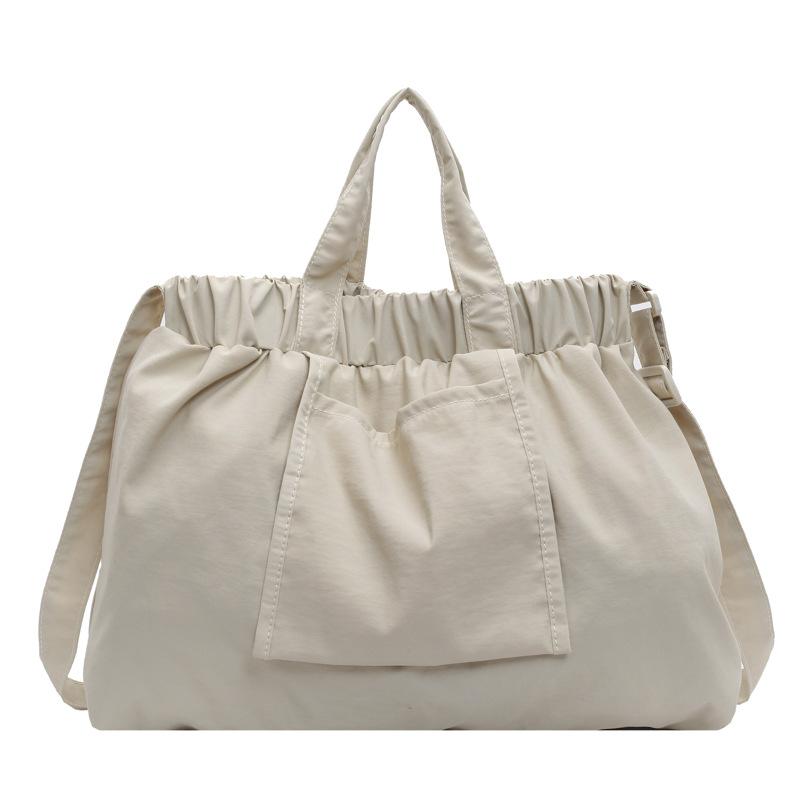 

Niche casual simple messenger bag bag elastic band design portable tote bag large capacity dopamine shoulder women s bag one size fits all