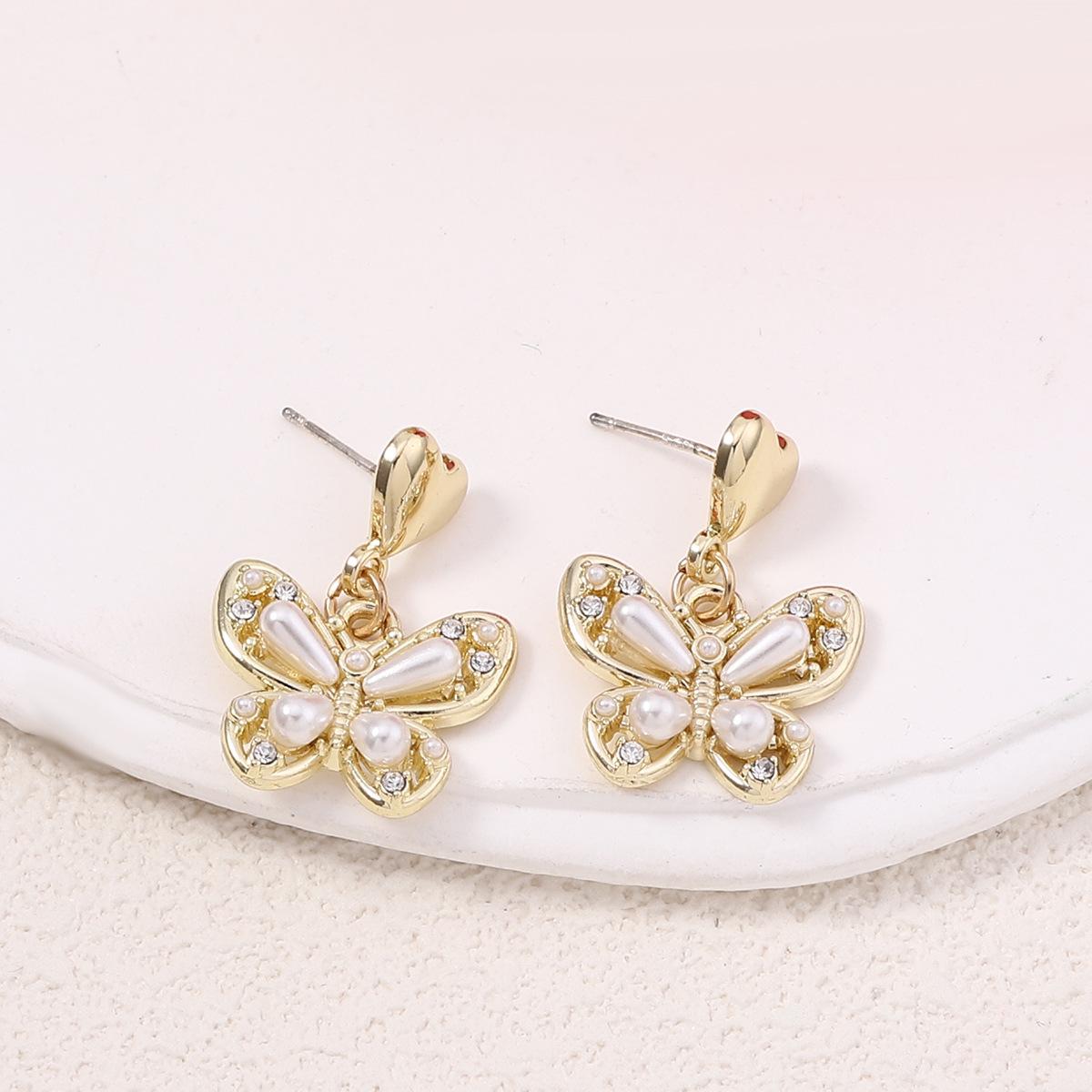 

Forest-themed alloy pearl butterfly niche earrings, fashionable, ethereal and versatile summer new arrivals