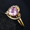 Gold and Pink Diamond Heart-shaped Ring Heart-shaped Ring with a Central Gemstone and Surrounding Cubic Zirconia