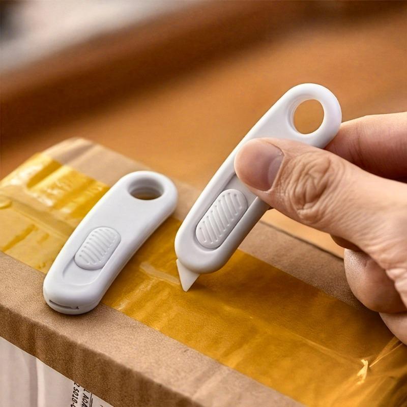 A small envelope and parcel scissors, designed for safety and concealment, perfect for opening envelopes and parcels