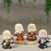Musikalische Buddha-Dekoration für die Heimdekoration (4er-Pack, Mehrfarbig)