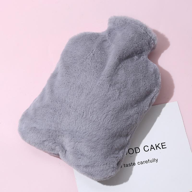 Thickened, explosion-proof hot water bottle for girls with imitation rabbit fur; perfect as a hand warmer, stomach compress, or foot warmer.
