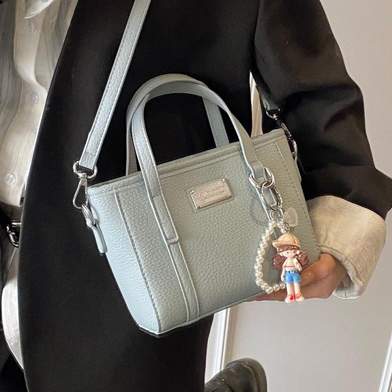 Spring hot sale lychee pattern high-end portable bucket bag Korean version casual small fresh temperament versatile messenger women's bag