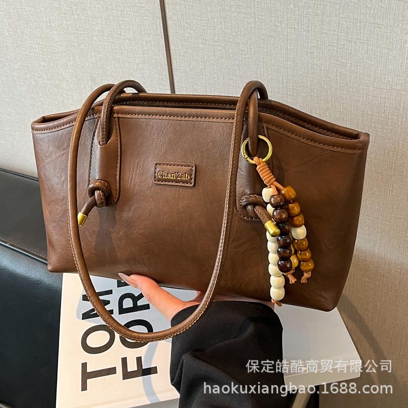 

Женская сумка через плечо большой вместимости 2025 новая трендовая осенне-зимняя ретро мода сумка-тоут для通勤 ручная сумка чёрный