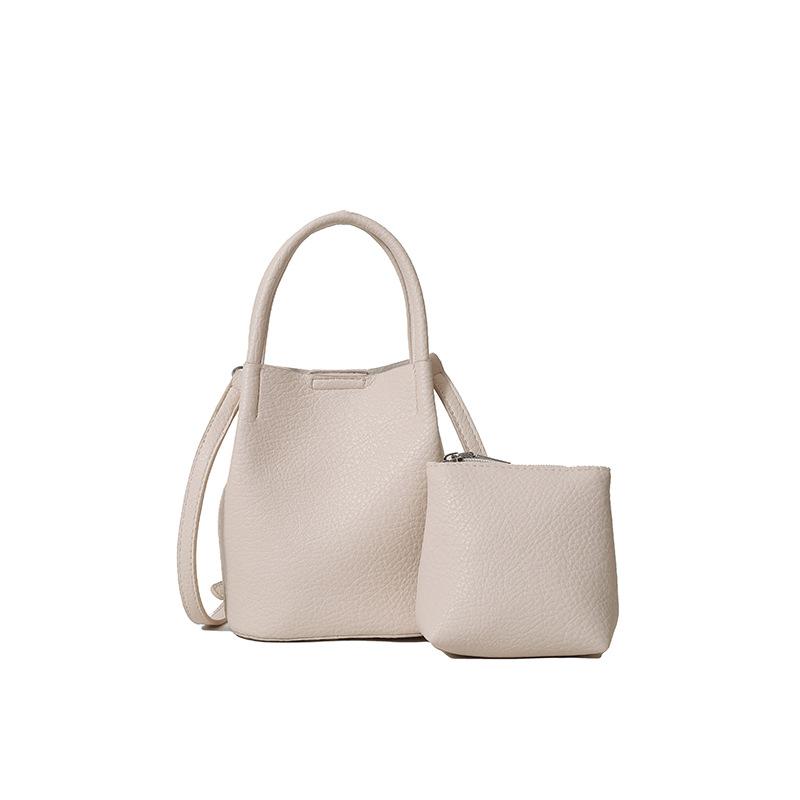 Wholesale simple texture solid color portable bucket bag women's casual versatile light commuter wind messenger mother and child bag