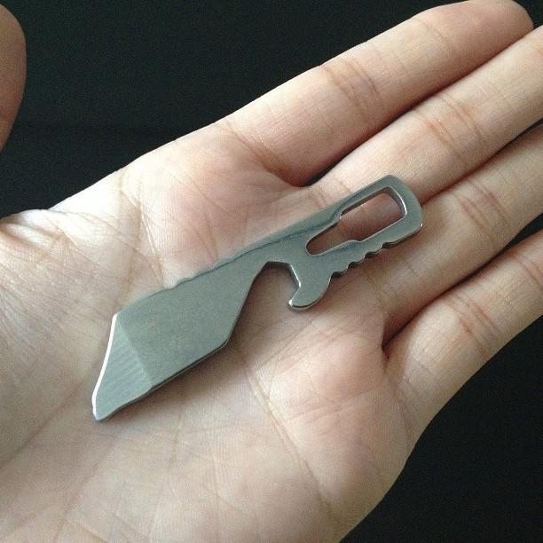 Compact Outdoor Multi-Tool: Bottle Opener, Box Scraper, Screwdriver, and Pry Bar