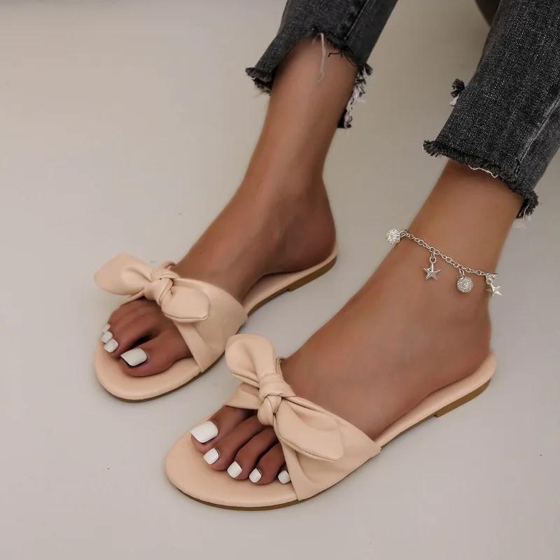 Модне взуття для жінок 2024 Гарячий розпродаж Жіночі шльопанці з відкритим носком Літні з бантом Однотонні Вуличні Повсякденні Пляжні Плоскі Зручні Шльопанці