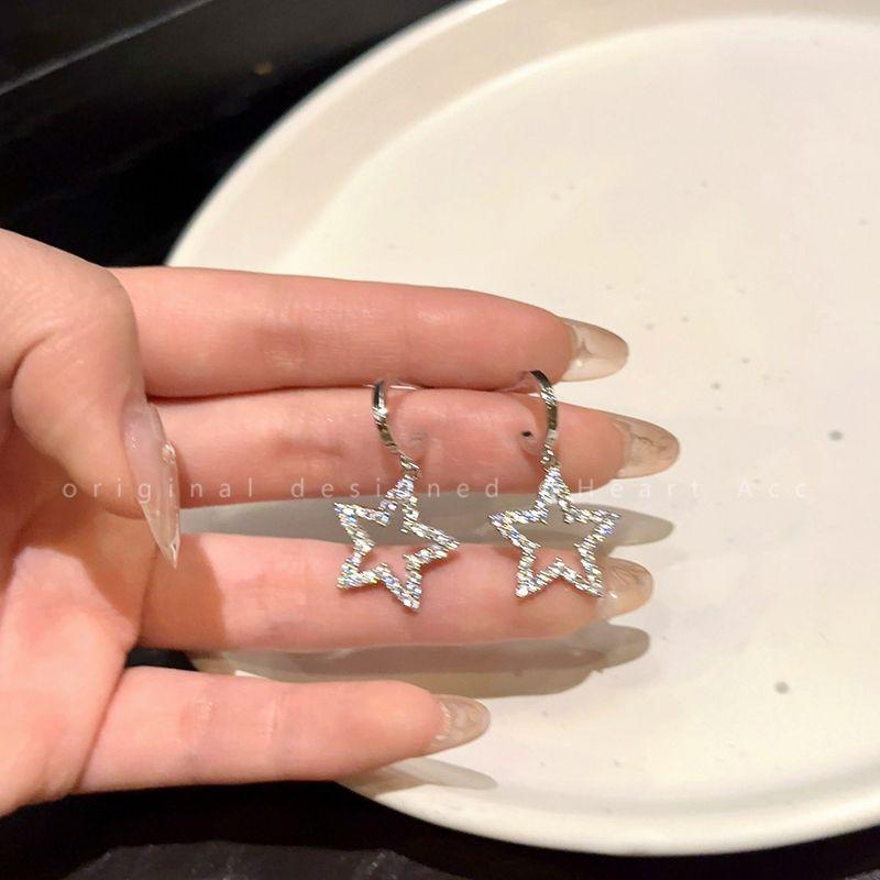 

Cold Style Hollow Stars Female Sweet Cool Sexy Zircon Cut Out stars zircon earrings (Silver Needle)