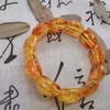 Ethnic Style Amber Acrylic Flower Bracelet: Semi-Circular Hand-Strung Design for Men and Women.
