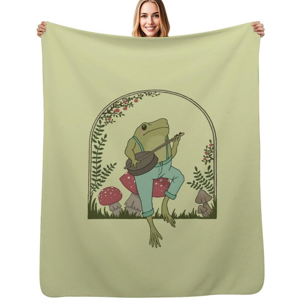 Cottagecore Aesthetic Frog Playing Banjo On Mushroom Cute Vintage Goblincore Farmer Toad In Garden Dark Academ Throw Blanket