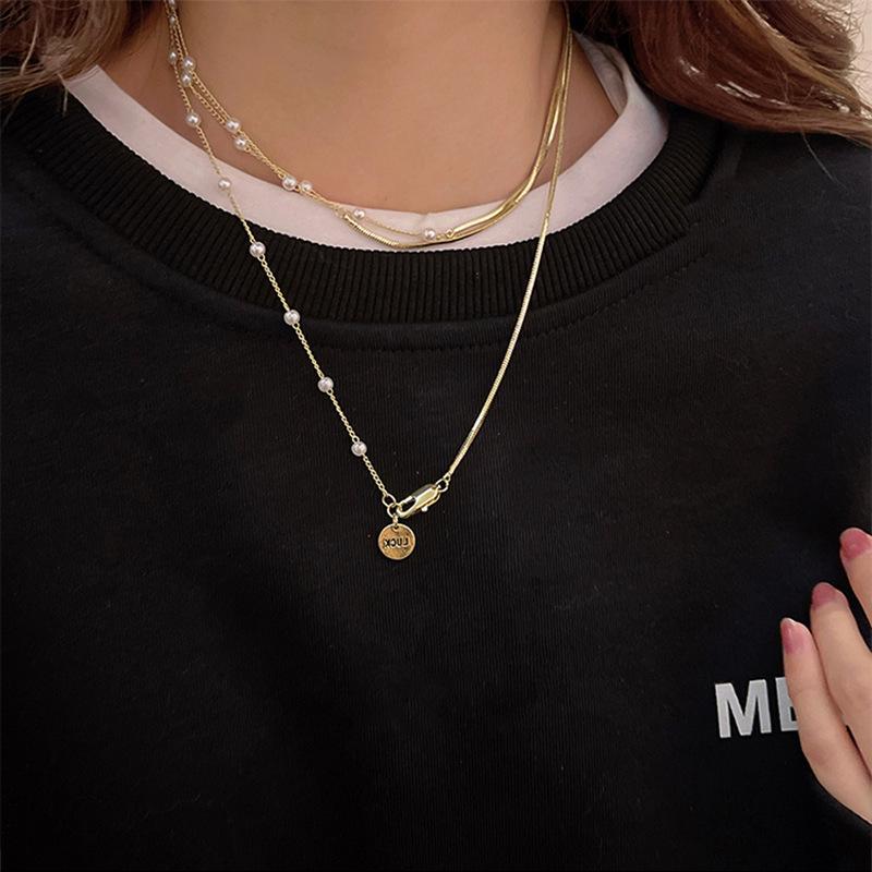 2023 Elegant Pearl Pendant Necklace: Niche Design Sweater Chain for Women
