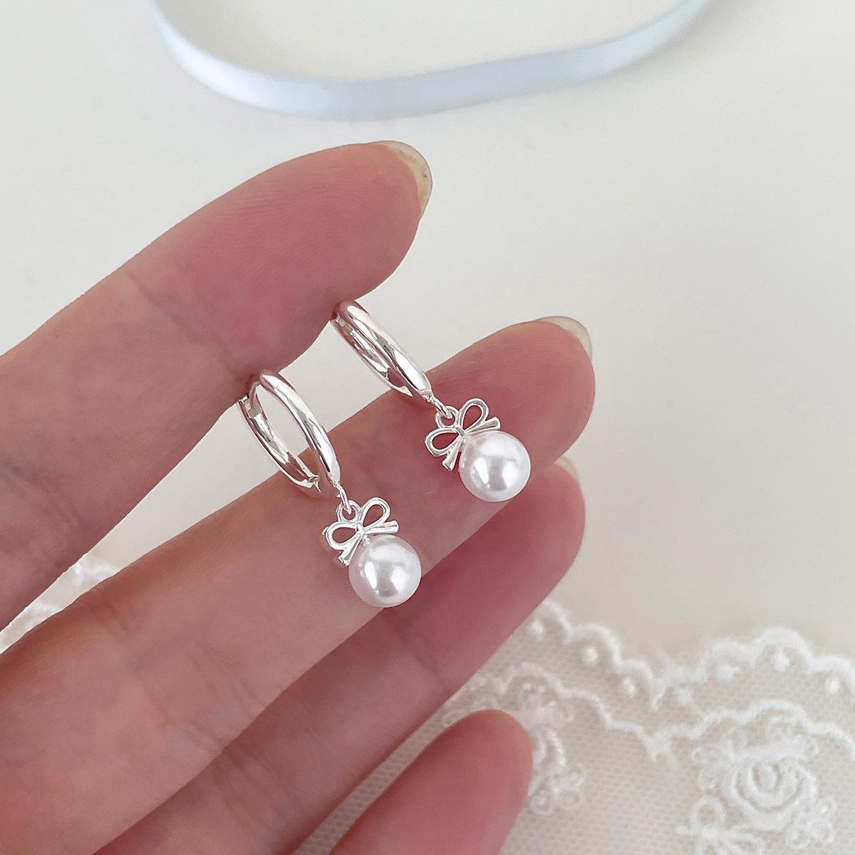 

Korean simple bow pearl earrings women s niche high-end earrings temperament light luxury small fragrant new earrings copper