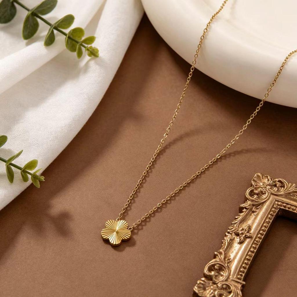Gold-Plated Titanium Steel Four-Leaf Clover Jewelry Set: Necklace, Bracelet & Earrings for Women – Luxurious High-End Feel.