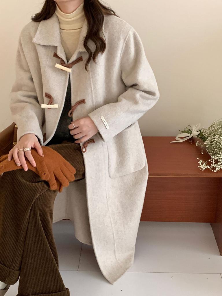 New double-sided wool coat, long big pocket horn wood buckle doll collar, thickened long wool cashmere coat.