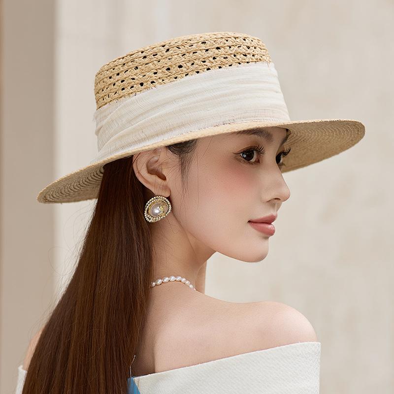 Hollow raffia flat top summer high-end travel seaside sunshade breathable straw hat sunshade French straw hat