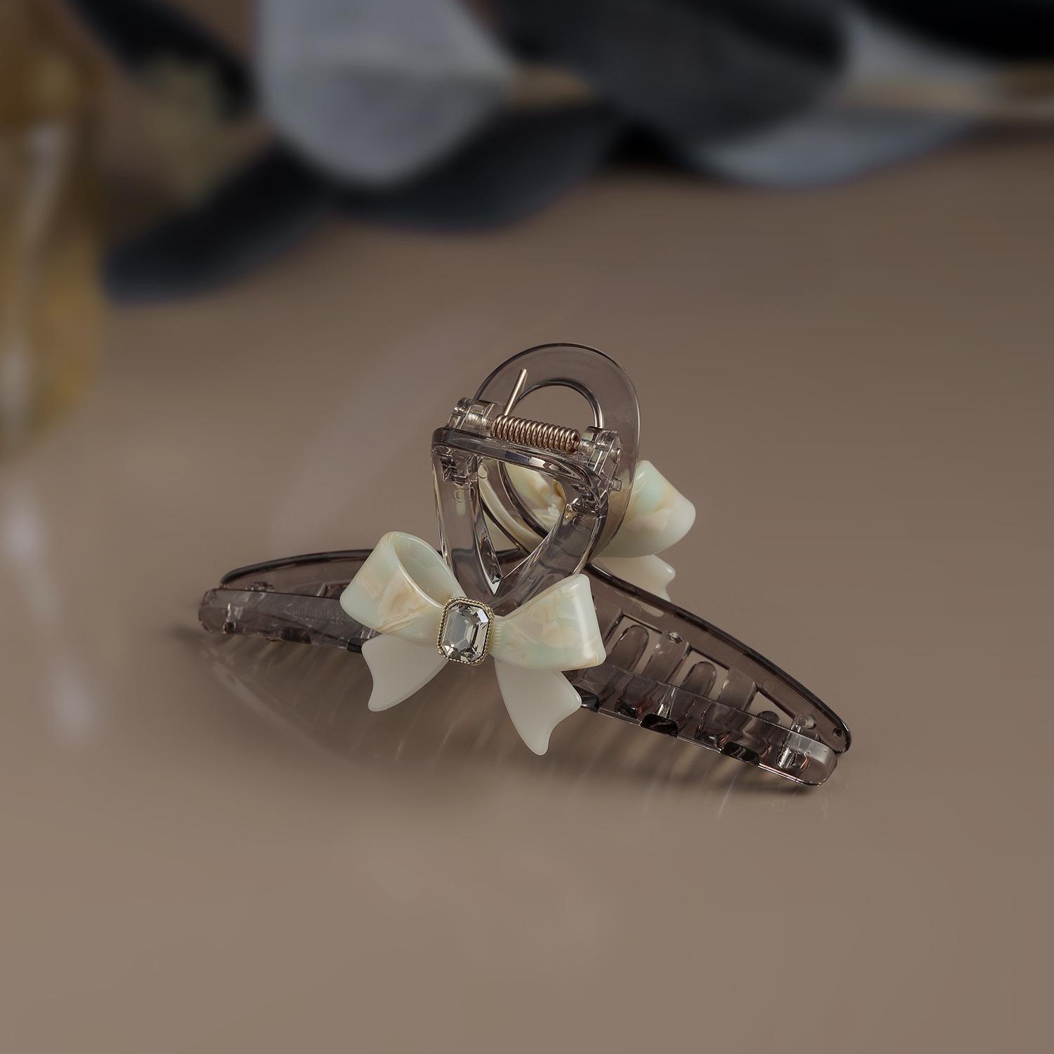 

Напівпрозорий акриловий затискач-кіготь у формі банта - Стильний та ніжний аксесуар для жінок One Size