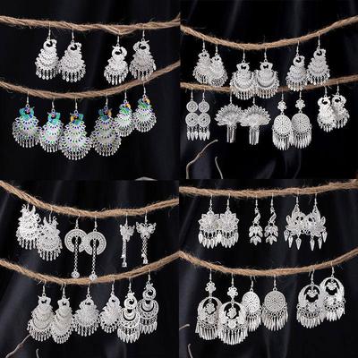 Bohemian Ethnic Miao Silver Tassel Earrings with Butterfly, Peacock, and Flower Design for Women – Long Dangle Jewelry for Travel Photos.