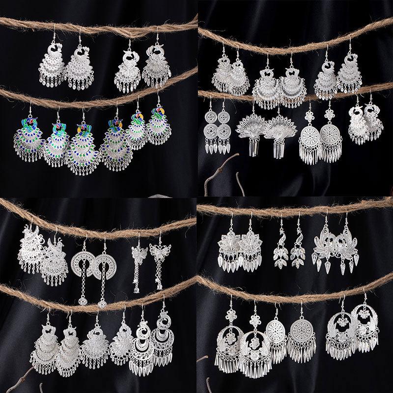Bohemian Ethnic Miao Silver Tassel Earrings with Butterfly, Peacock, and Flower Design for Women – Long Dangle Jewelry for Travel Photos.