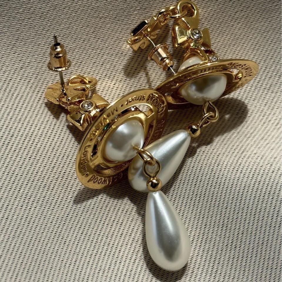 

Колье-чокер Westwood Saturn: Высокая версия, средний размер, женские бусины 10 мм, застежка с логотипом. Complete Logo Details