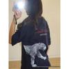 Camiseta de algodón de manga corta holgada con estampado de leopardo: un estilo urbano moderno, fresco y a la moda.