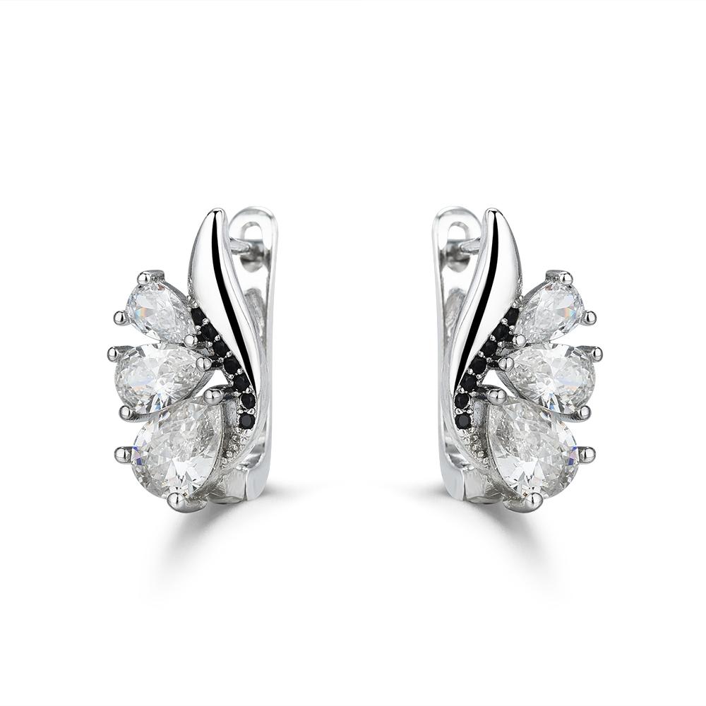 

Ювелирные изделия в виде сережек-колец с черными и белыми камнями