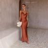 Women's Urban Fashion Solid Color Dress with Deep V-neck, Slim Fit, and Spaghetti Straps for Spring/Summer 2024.