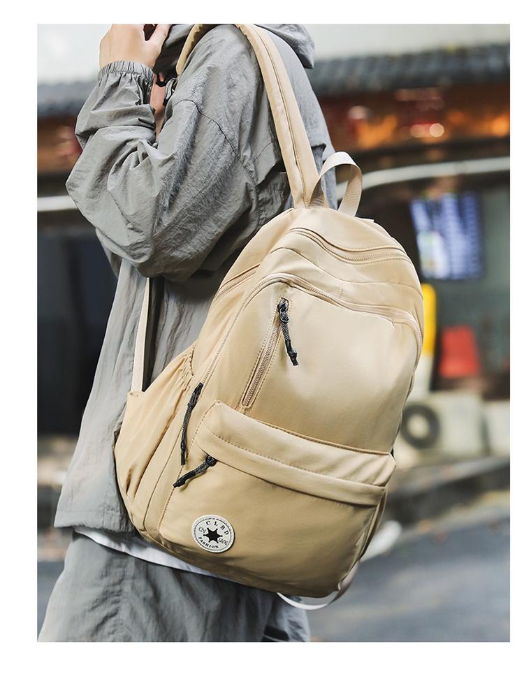 Niche Lightweight Nylon Backpack: Large-Capacity, Casual, Unisex Shoulder Bag for Commuters and Students