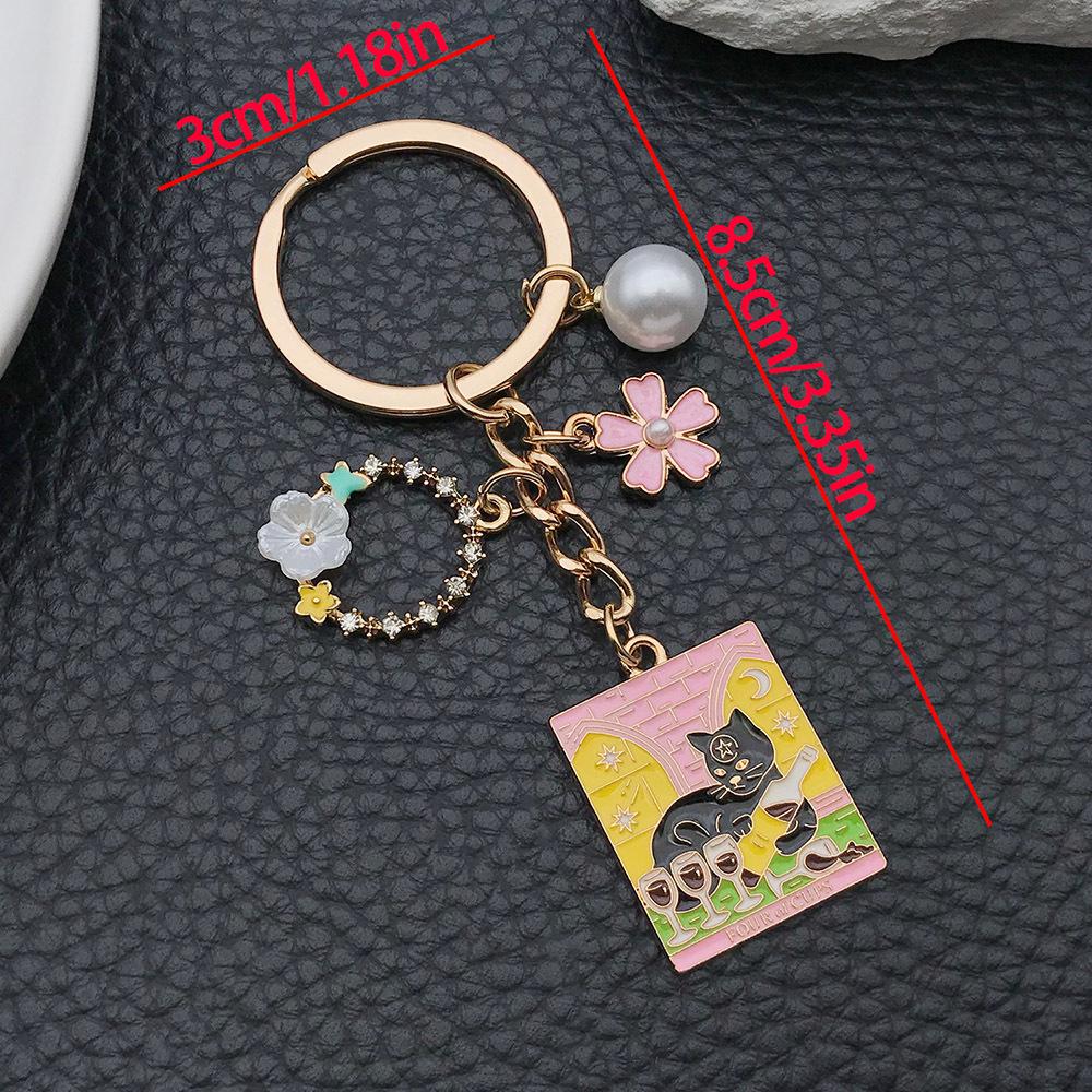 Adorable Pink Cat Compass Keychain with Cartoon Drip Oil and Butterfly Wreath Pendant