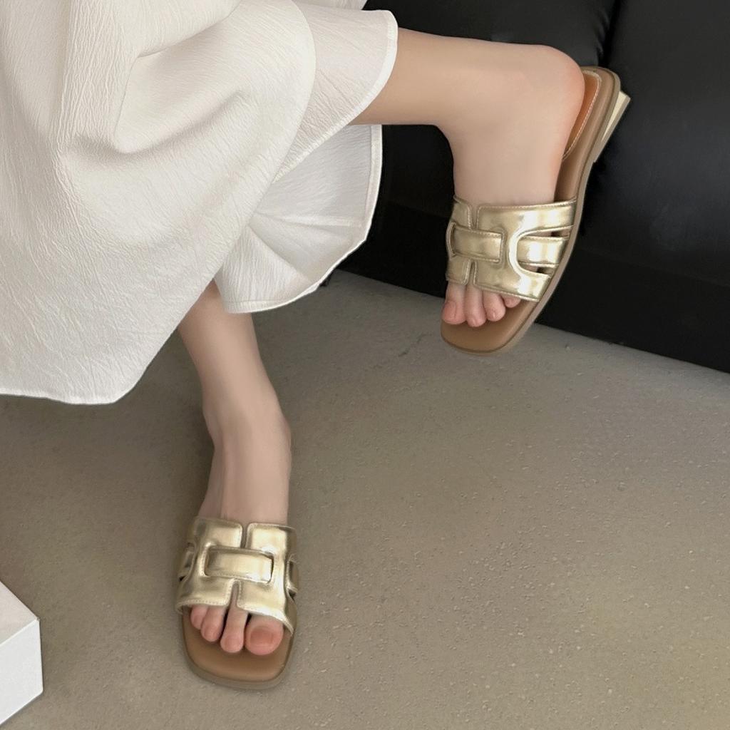 Wearing open toed woven beach sandals with a single low heel for outdoor wear