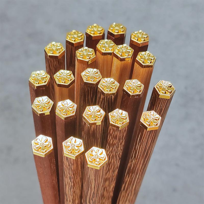 

Japanese Gold-Topped Hexagonal Chopsticks with Metal Head, Wooden Base, and Rosewood Design for Families and Hotels.
