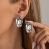 Irregular liquid metal wrinkled earrings with temperament for commuting, diamond studded transparent gemstone earrings for women