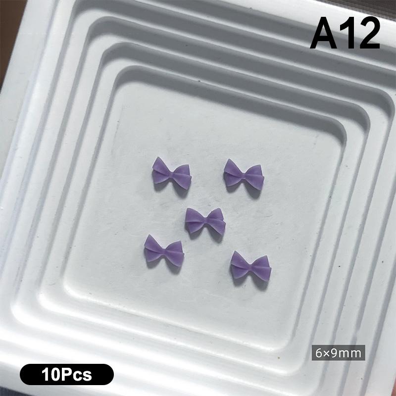 10 Stück Doppellagige Schleifen-Nagelanhänger 3D Süße Band-Schleifen Nagelkunst Strasssteine Mini Harz-Fliege Maniküre Schmuck DIY Teile