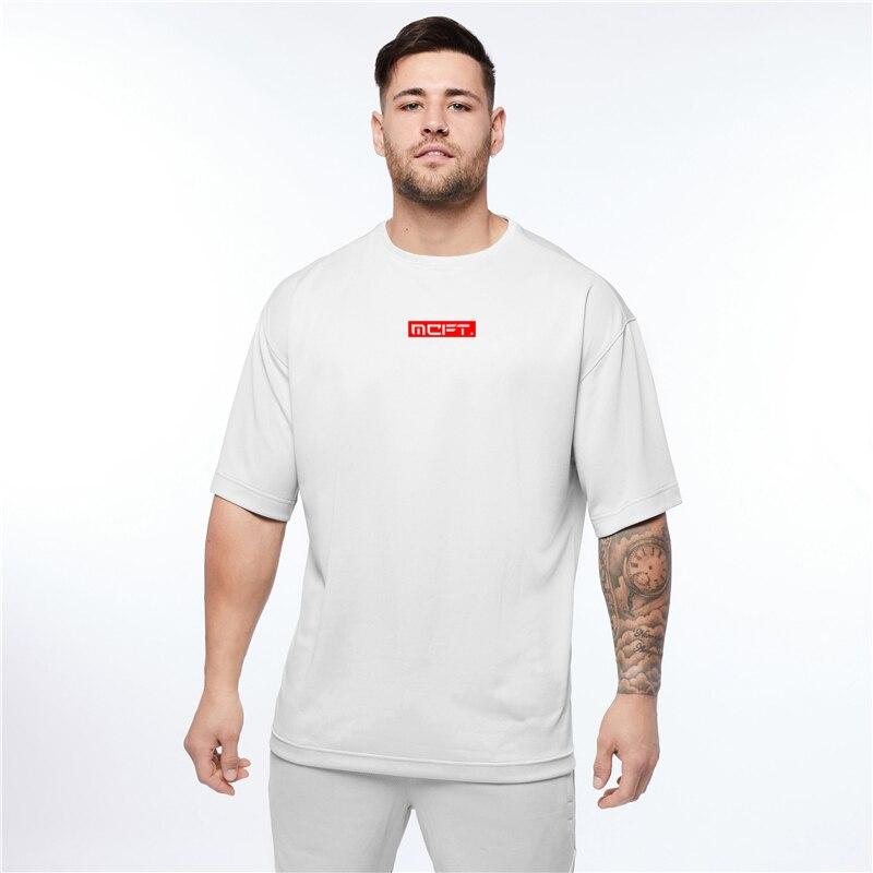 Muscleguys Pánské sportovní fitness oblečení volné tréninkové tričko s krátkým rukávem léto rychle schnoucí