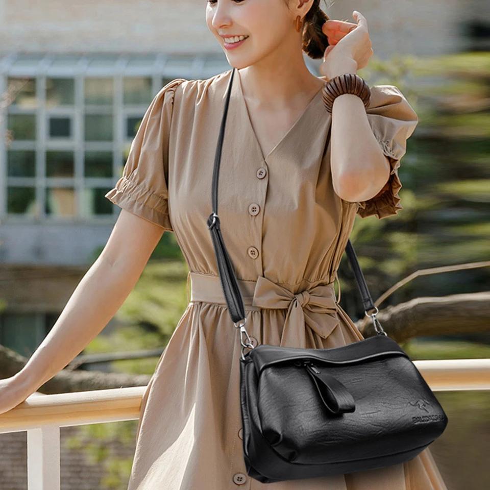 Women's Black Crossbody Bag with Embossed Kangaroo Logo Three Main Compartments Leather Shoulder Bag