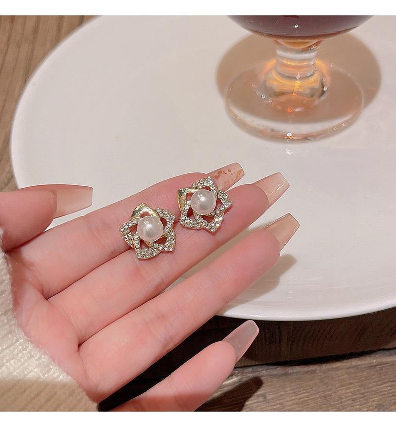 Exquisite diamond studded rose earrings with a luxurious and socialite style design, featuring pearl earrings and earrings