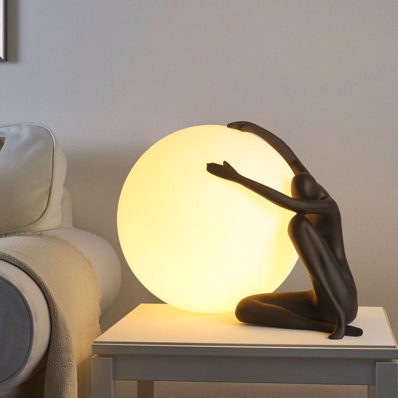 Modern Nordic Table Lamp Sculpture: Creative Doll Holding Luminous Ball for Bedroom and Living Room Decor